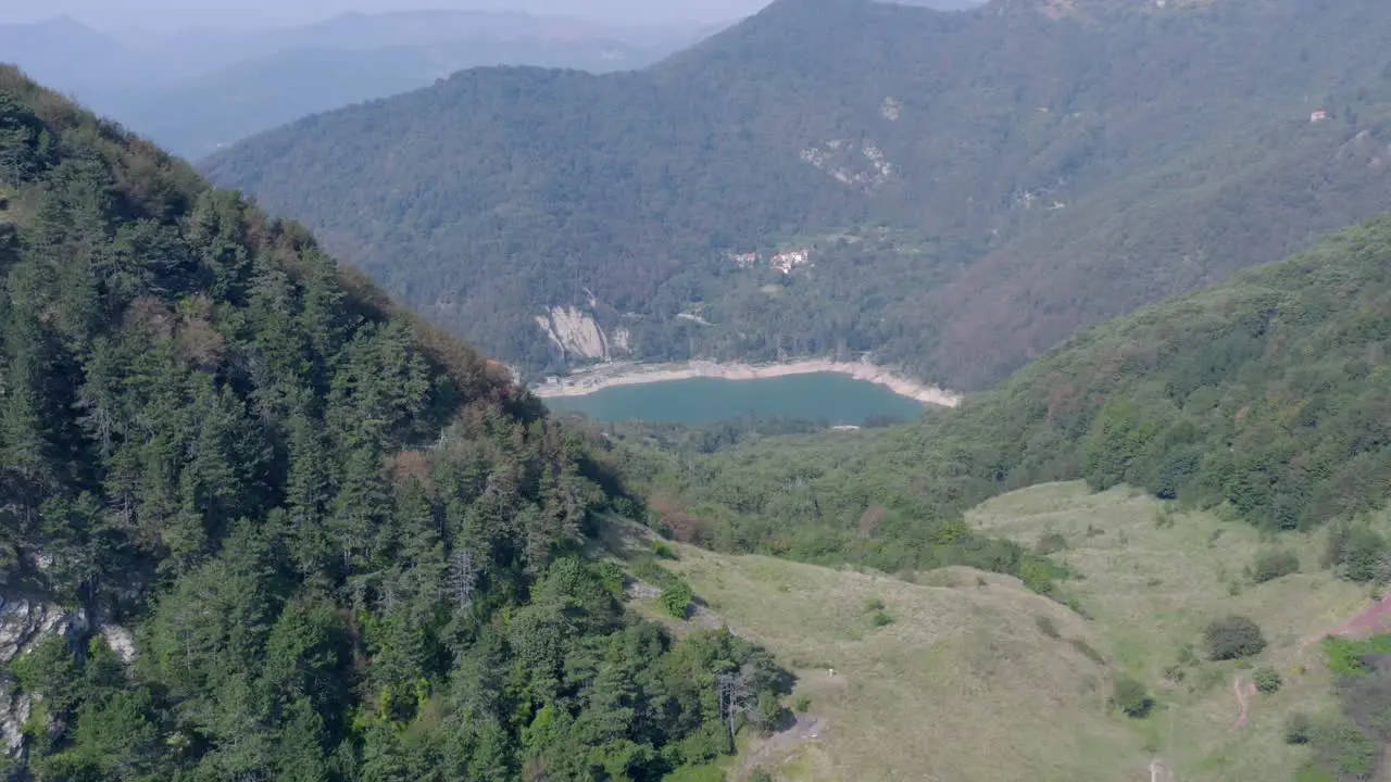 panning drone shot reveal an artificial lake near Genova Liguria Italy