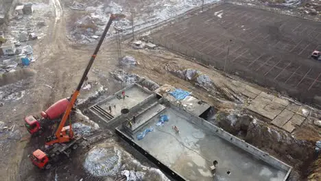 Drones aerial of a construction site of a pool formwork concrete blocks already finished and bricked up with construction adhesive steps already prepared and ready for concrete filling