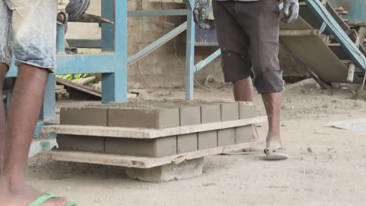 brick factory in india labor working as a team carrying bricks for construction site