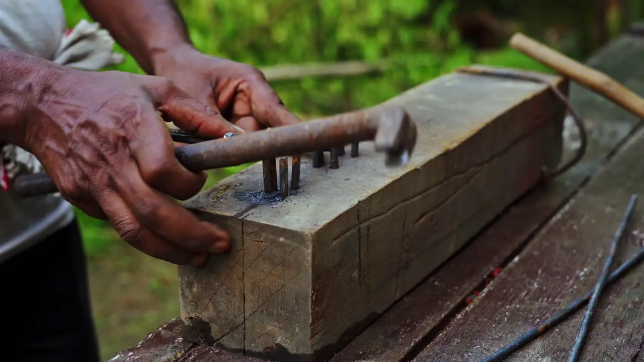 carpenter working in poor labor condition environment using manual tools in india