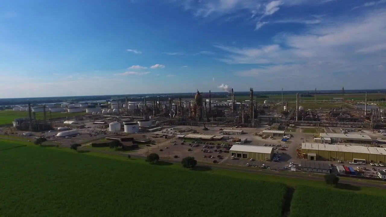 An aerial over an industrial oil refinery in an area of natural beauty 1