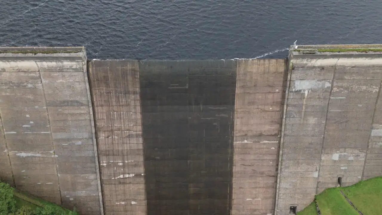 Booth wood reservoir aerial view looking down over concrete barrier holding flowing West Yorkshire lake