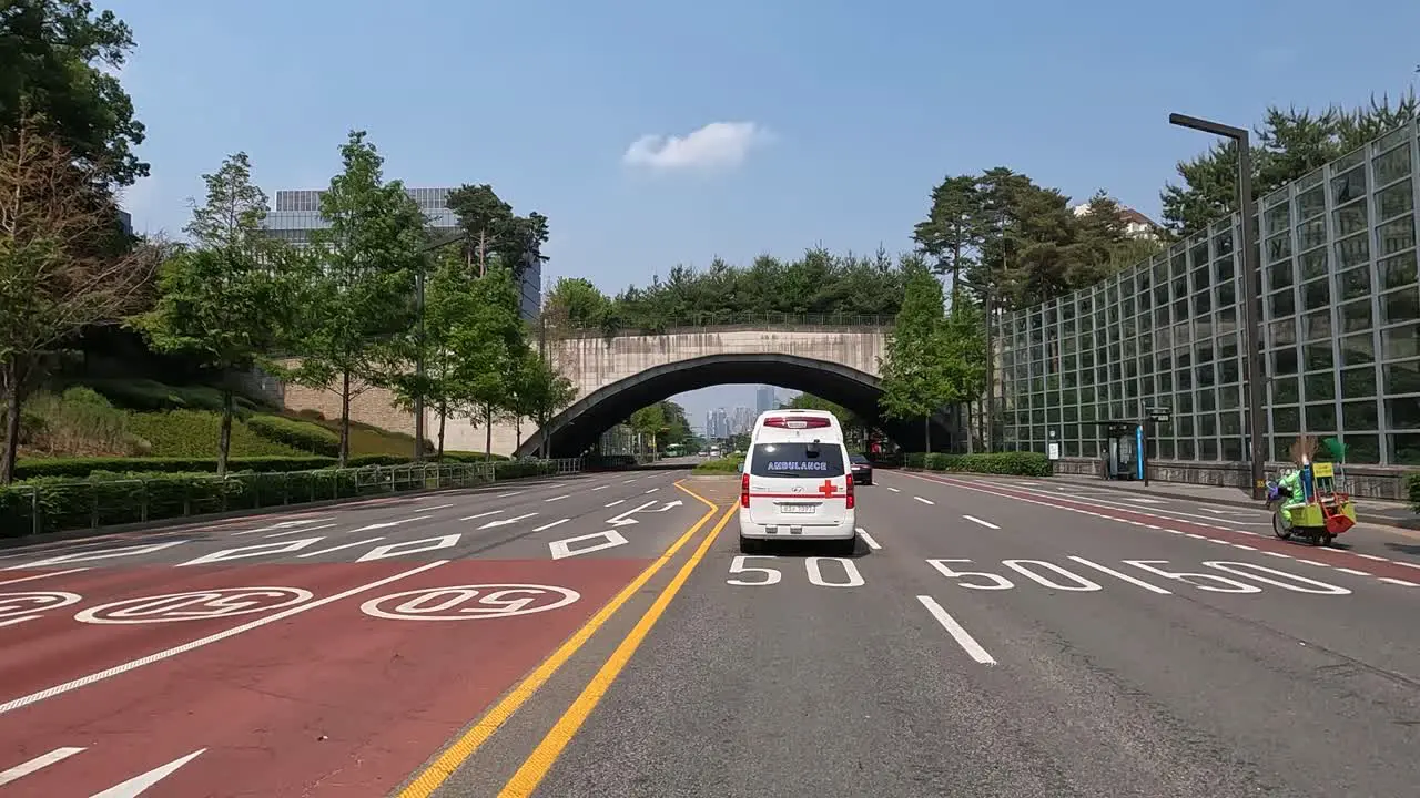 POV From A Car Driving Behind An Ambulance Travelling In The City Of Seoul South Korea