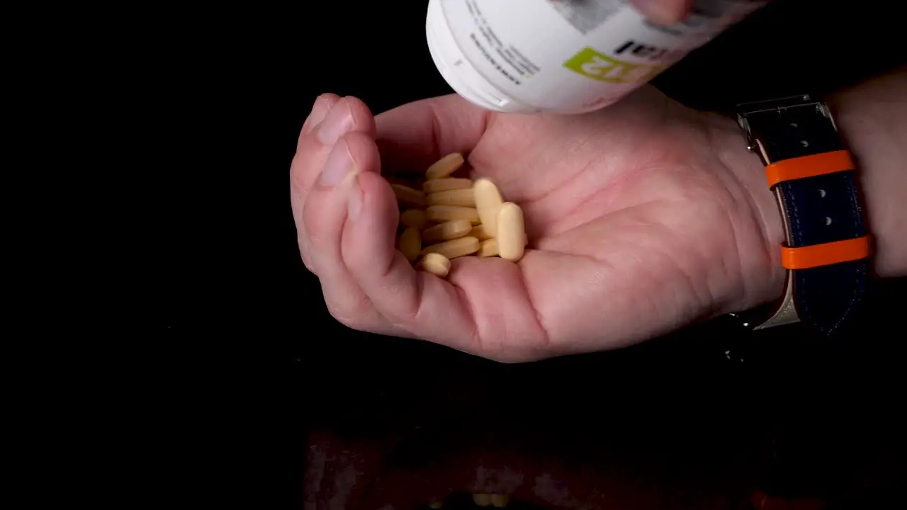 B12 Vitamin Pills Being Poured into Hand