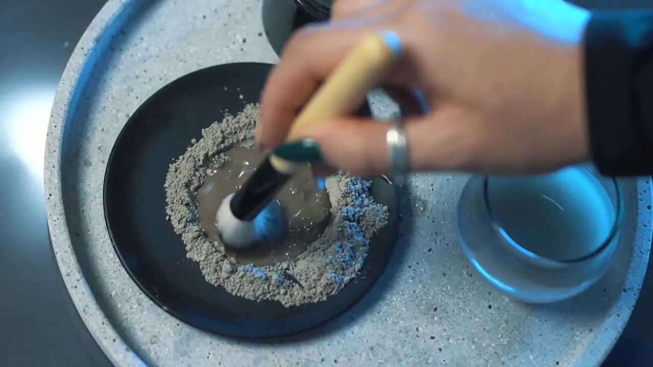 Preparing clay face masks for application to the face