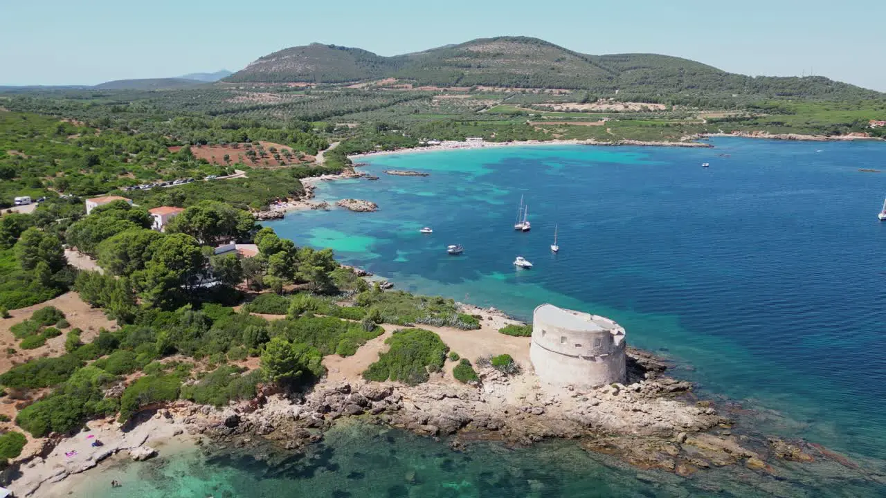 Small cove in front of Cala Spinosa Beach at Capo Testa Santa Teresa di Gallura Sardinia Italy 4k Aerial