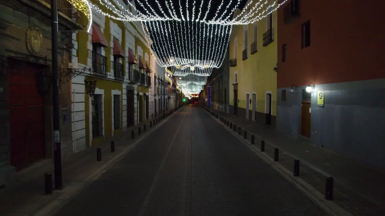 Drone push in footage of the Christmas lights and decorations in the streets of Puebla Mexico