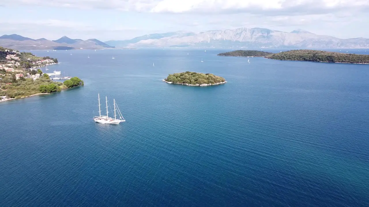 Big Luxury Boat Floats in Nidri Bay at Lefkada Greece Aerial Forward