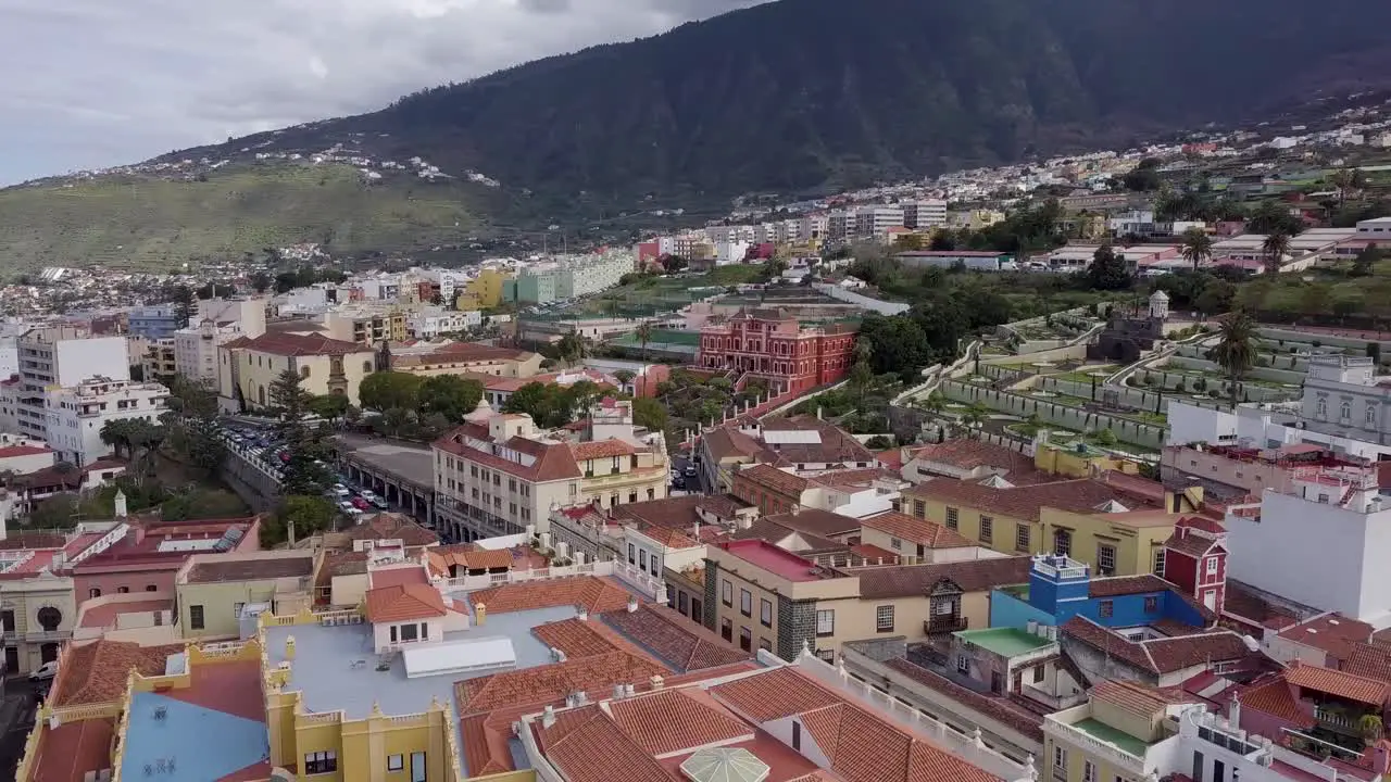 panoramic aerial footage of puerto De la Cruz spain tenerife island little town laid on ocean coastline