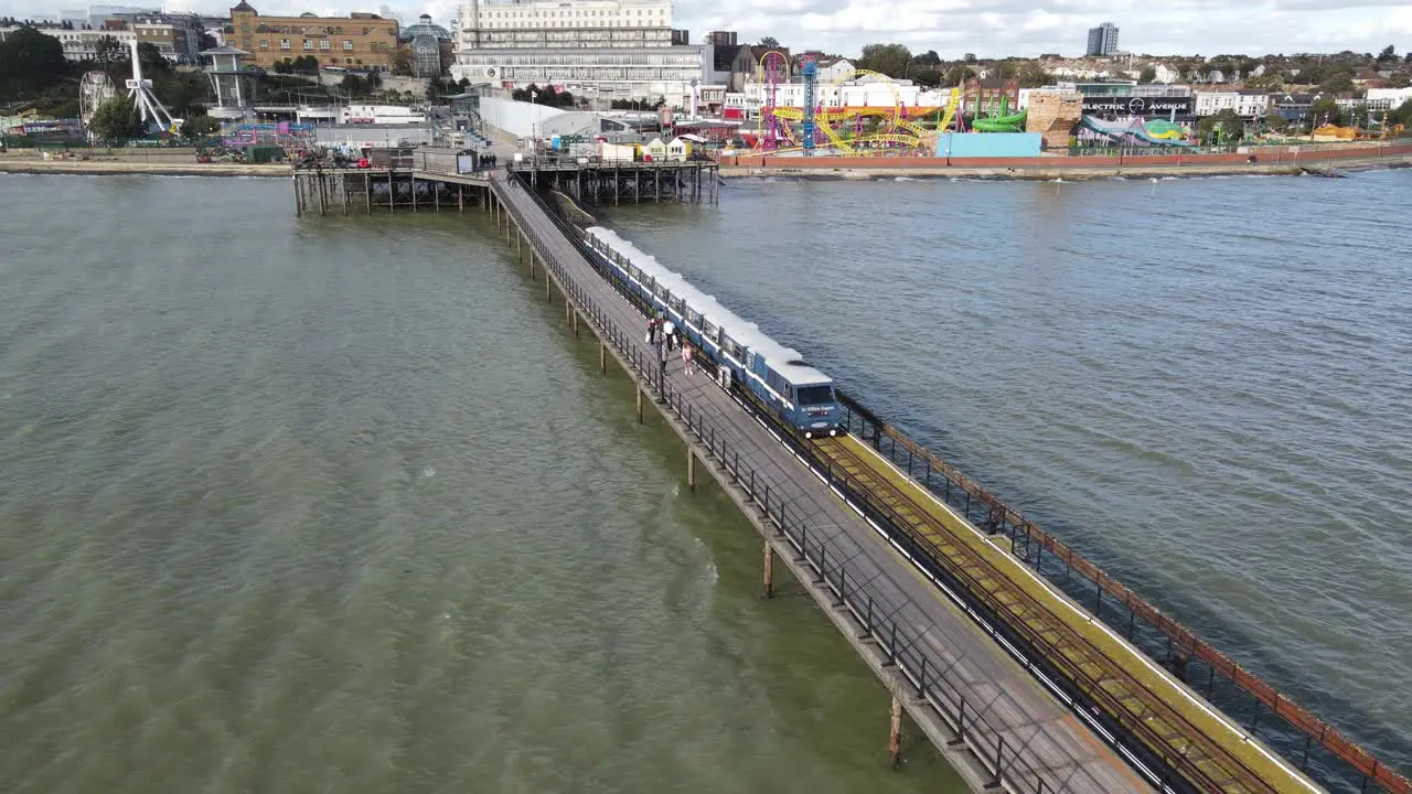 Aerial footage Southend on Sea pier train coming into station