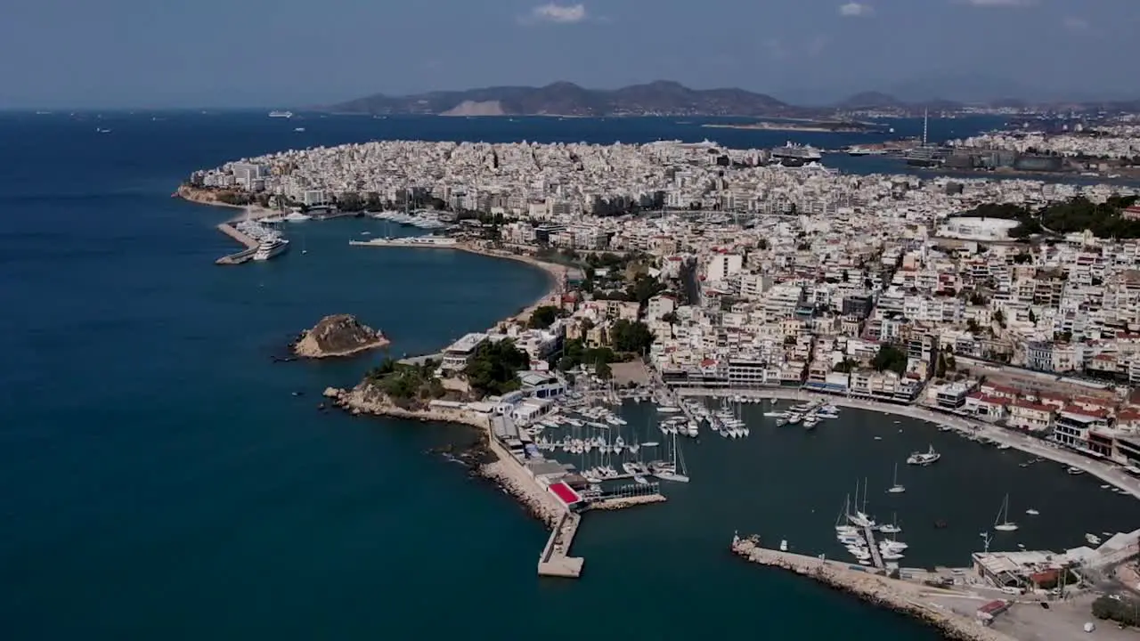 Aerial View of Greek Saronic Islands with many buildings and boats in the port