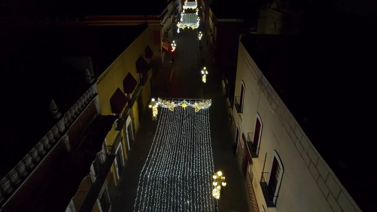 Drone footage showing the architecture and the Christmas light decorations of the streets