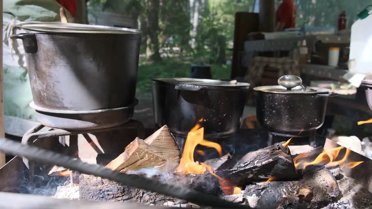 Preparing food on campfire in wild camping Cooked food on a campfire on a camping trip