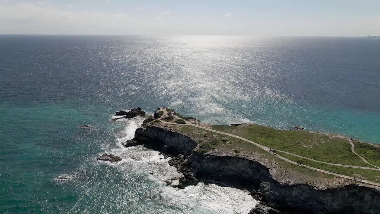 Aerial of Tourists walking on a cliff at Isla Mujeres Mexico