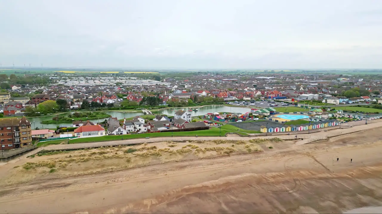 Aerial glimpses of Mablethorpe Lincolnshire's east coast retreat showcasing beach huts sandy beaches amusement parks rides and tourists