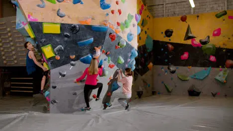 Friends bouldering indoors