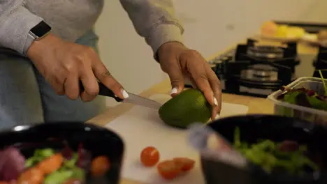 Woman cutting an avocado