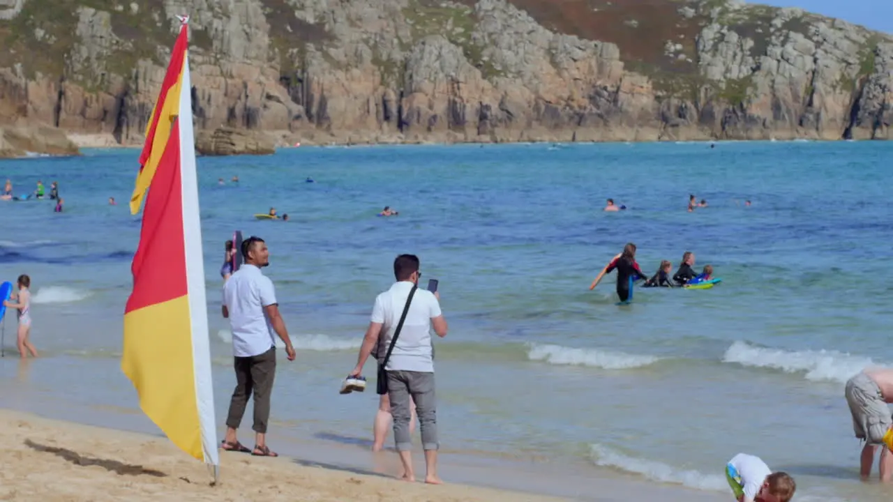 People young and old together having summer holiday fun at the beach slow motion