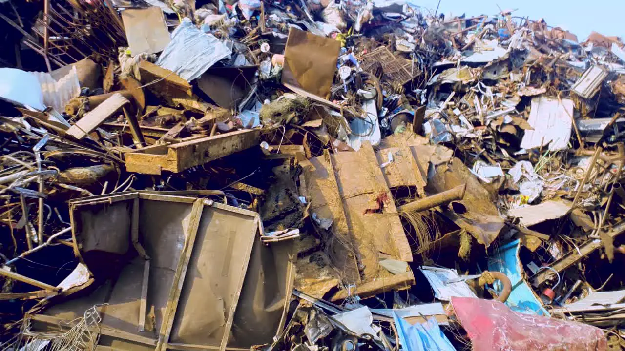 Panorama of heap of metal scrap at steel fabrication industry