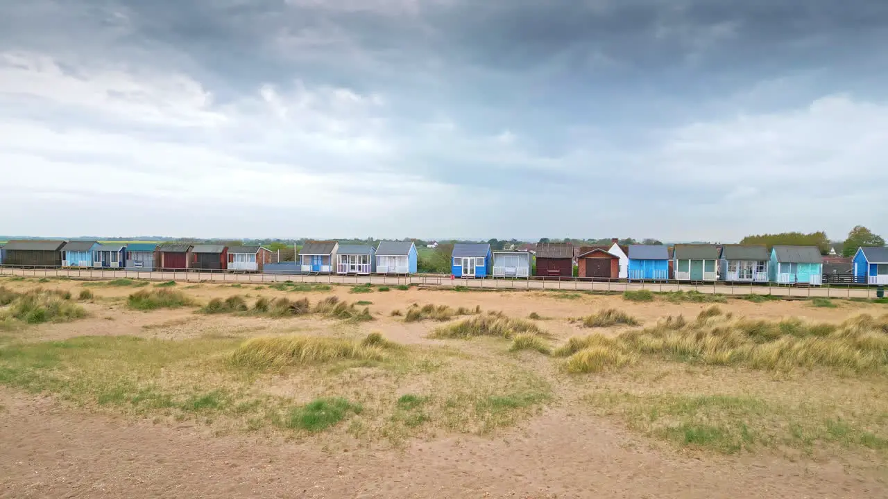 Behold aerial views of Mablethorpe's coastal elegance showcasing beach huts sandy beaches amusement parks rides and the vibrant tourists