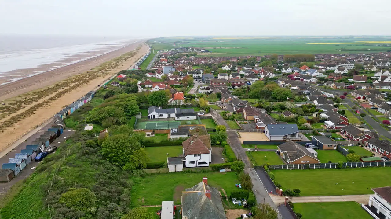 Discover the coastal haven of Mablethorpe through aerial views spotlighting beach huts sandy beaches amusement parks rides and the tourist’s delight