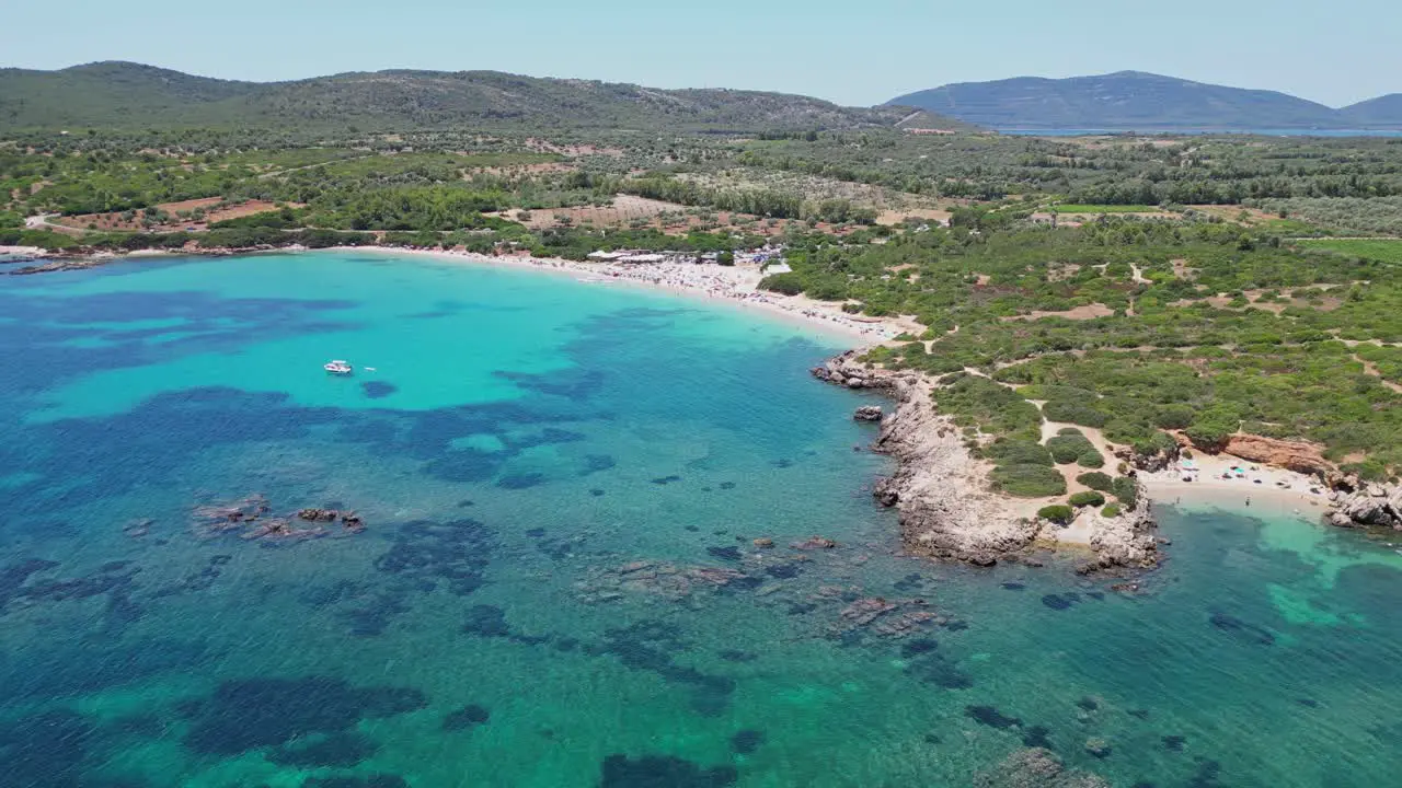 Cala Spinosa Beach at Capo Testa Santa Teresa di Gallura Sardinia Italy 4k Aerial Circling