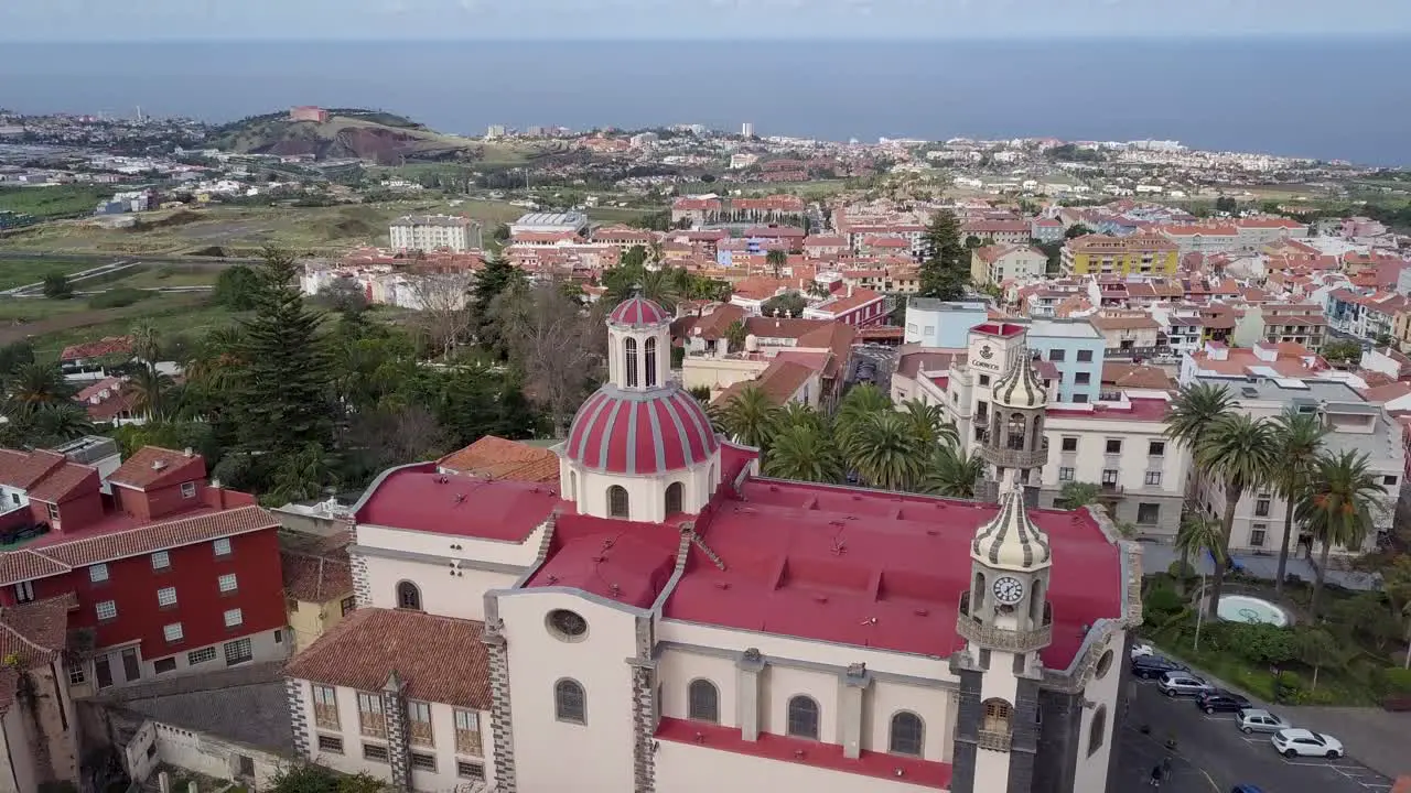 Puerto De la Cruz tenerife island aerial footage of old church in the little village in spain with ocean view