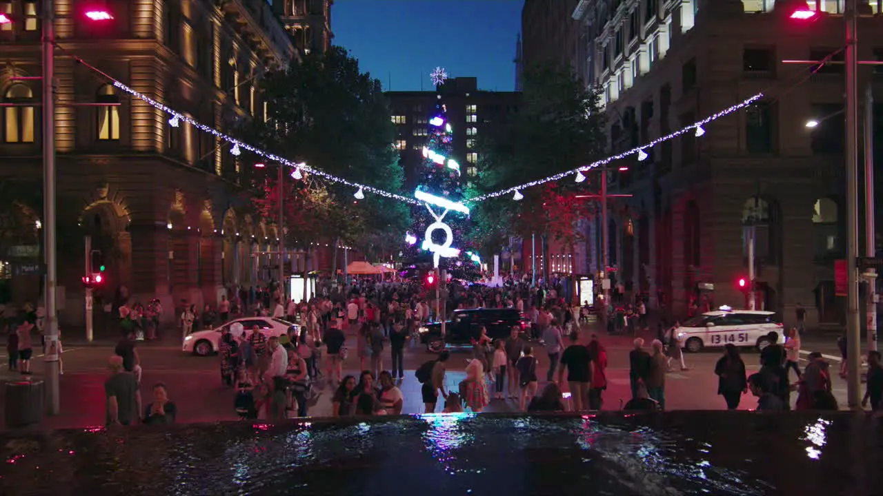 A street filled with people exploring the Christmas holiday festival in Sydney Australia