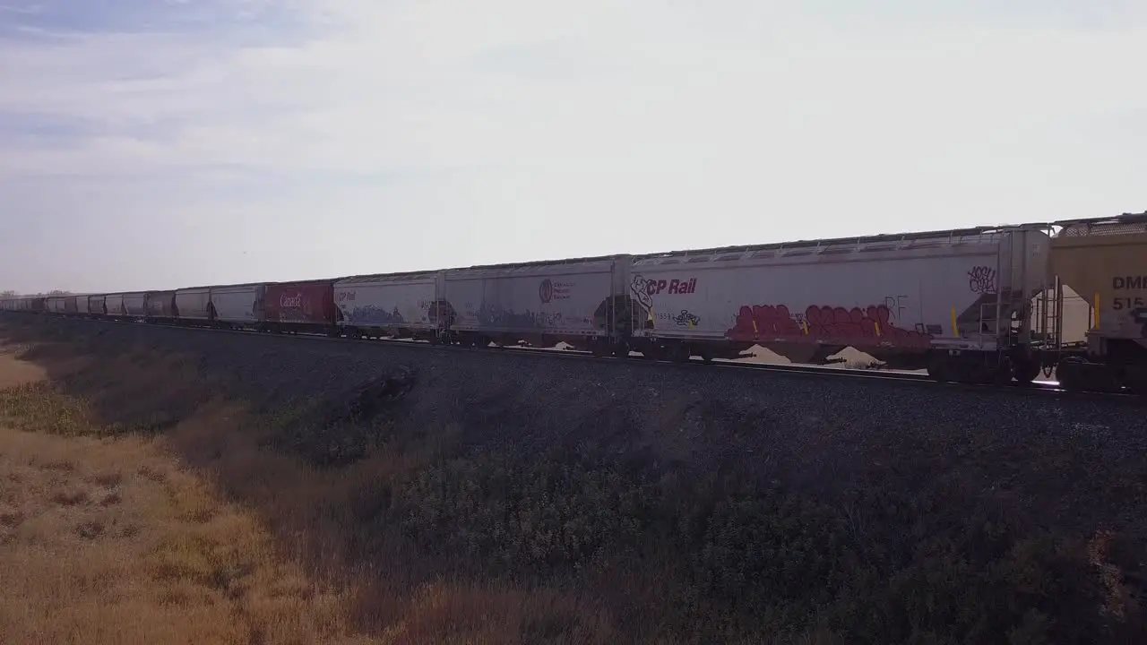 Slight trucking move as CP Rail train passes diagonally in frame