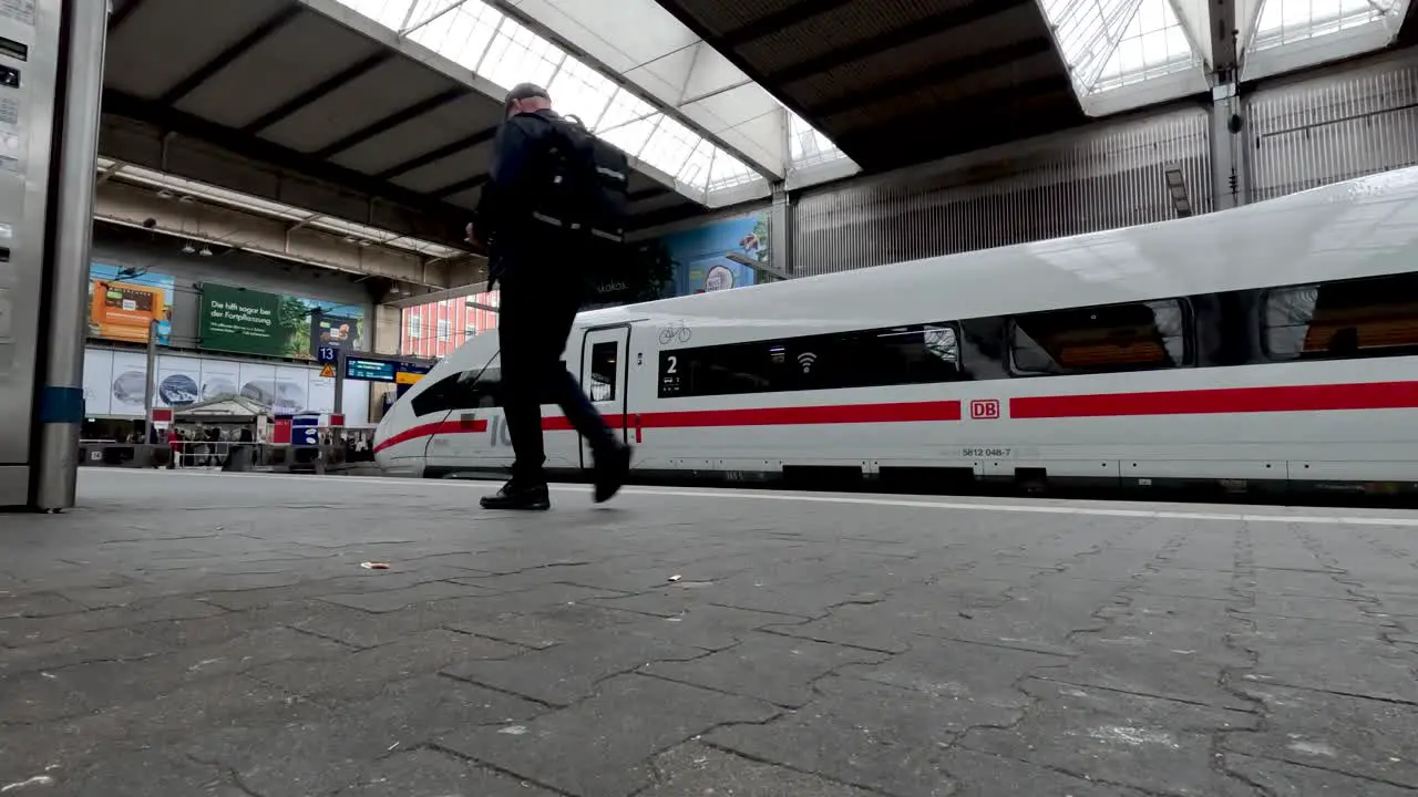 Commuter Walking Past DB ICE Train At Munich Central Station