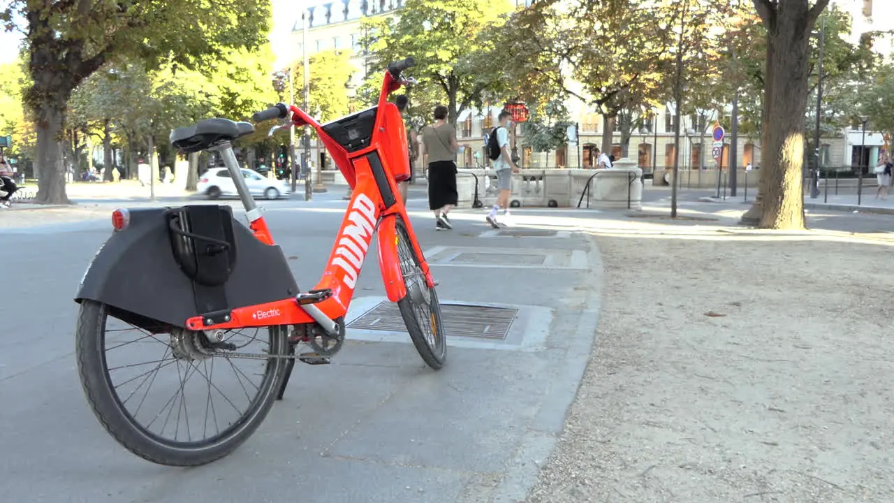 JUMP red dockless electric bike acquired by Uber parked near a subway metro station