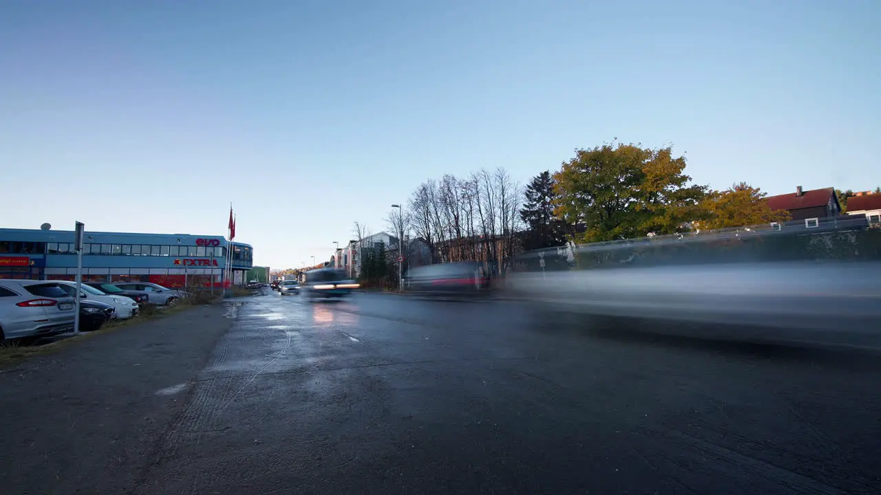 Passenger is waiting for a bus on station by busy road