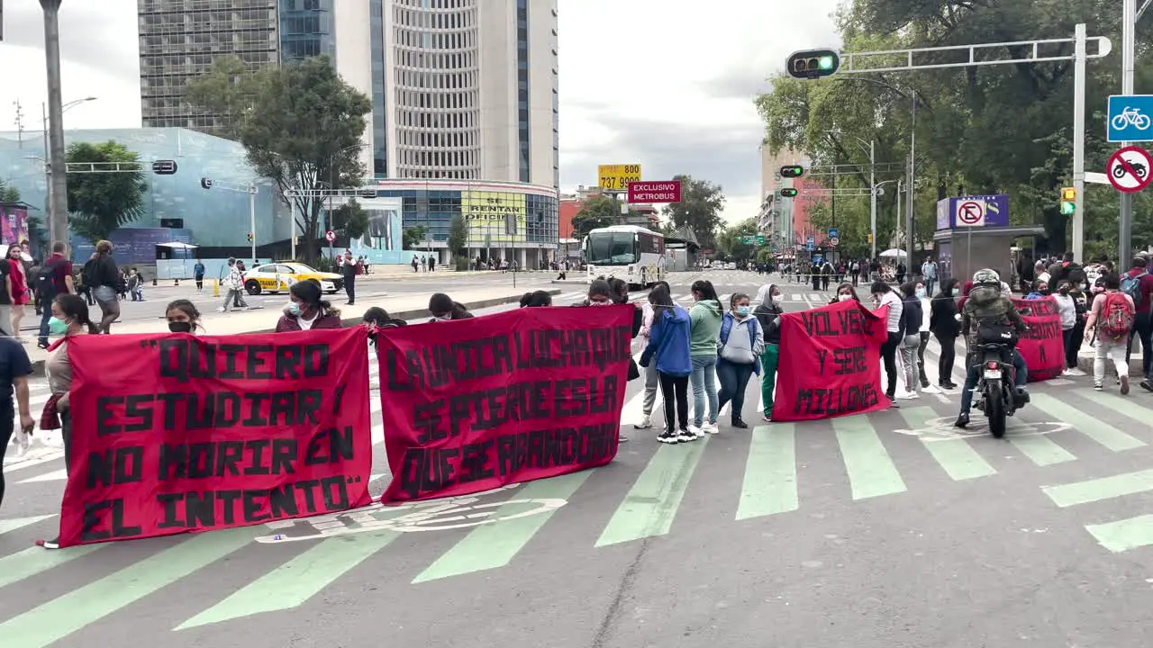 frontal shot of a student blockade on avenida reforma in mexico city