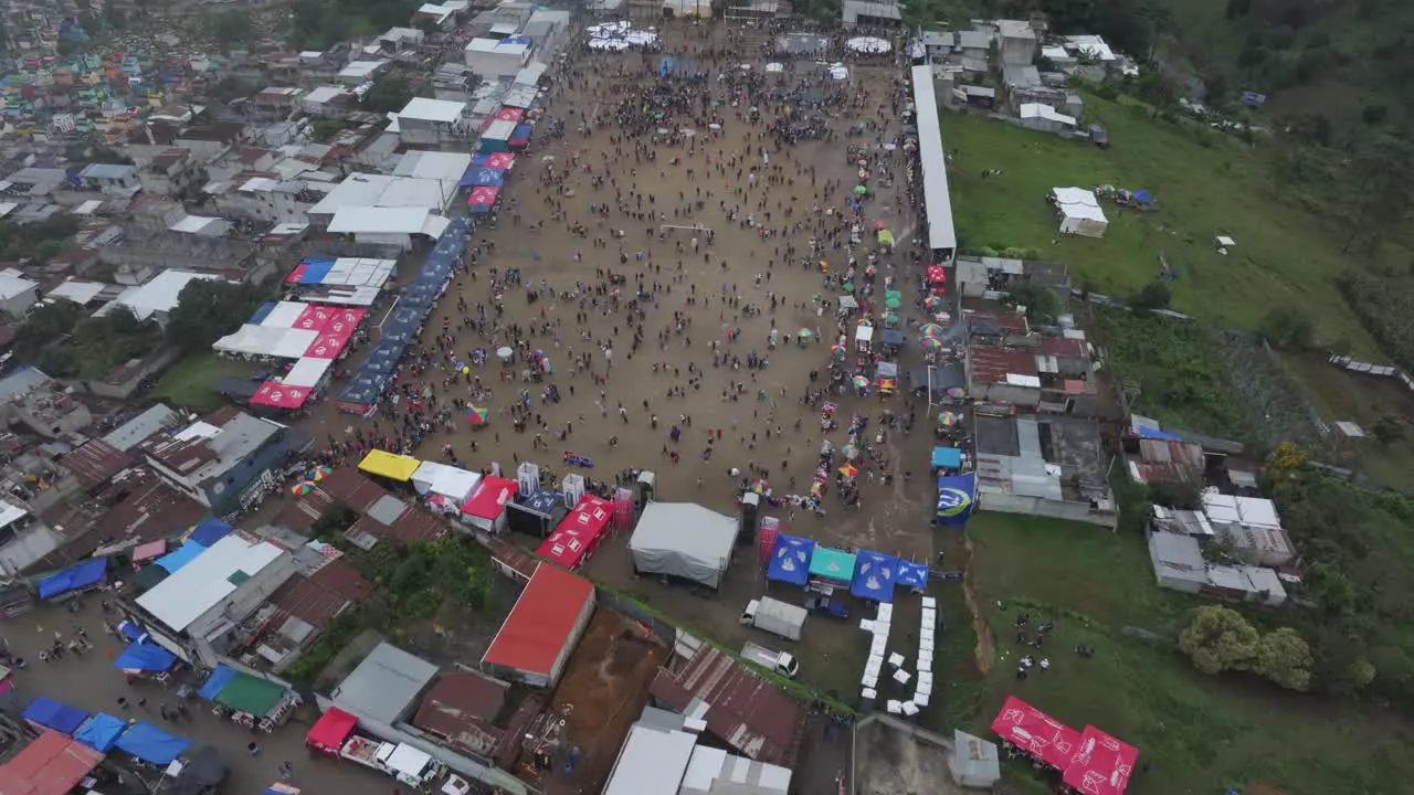 Wide shot of Sumpango Kite Festival during a moody day aerial