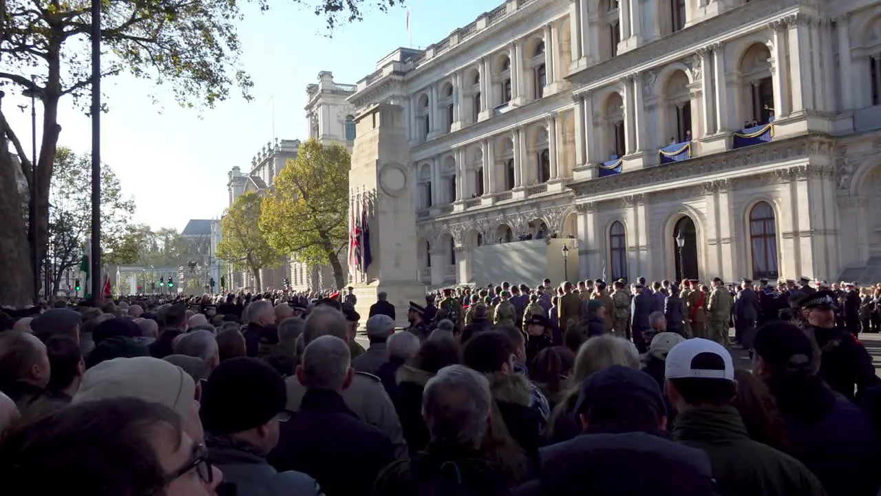 People gather at the Cenotaph on Armistice Day in London UK