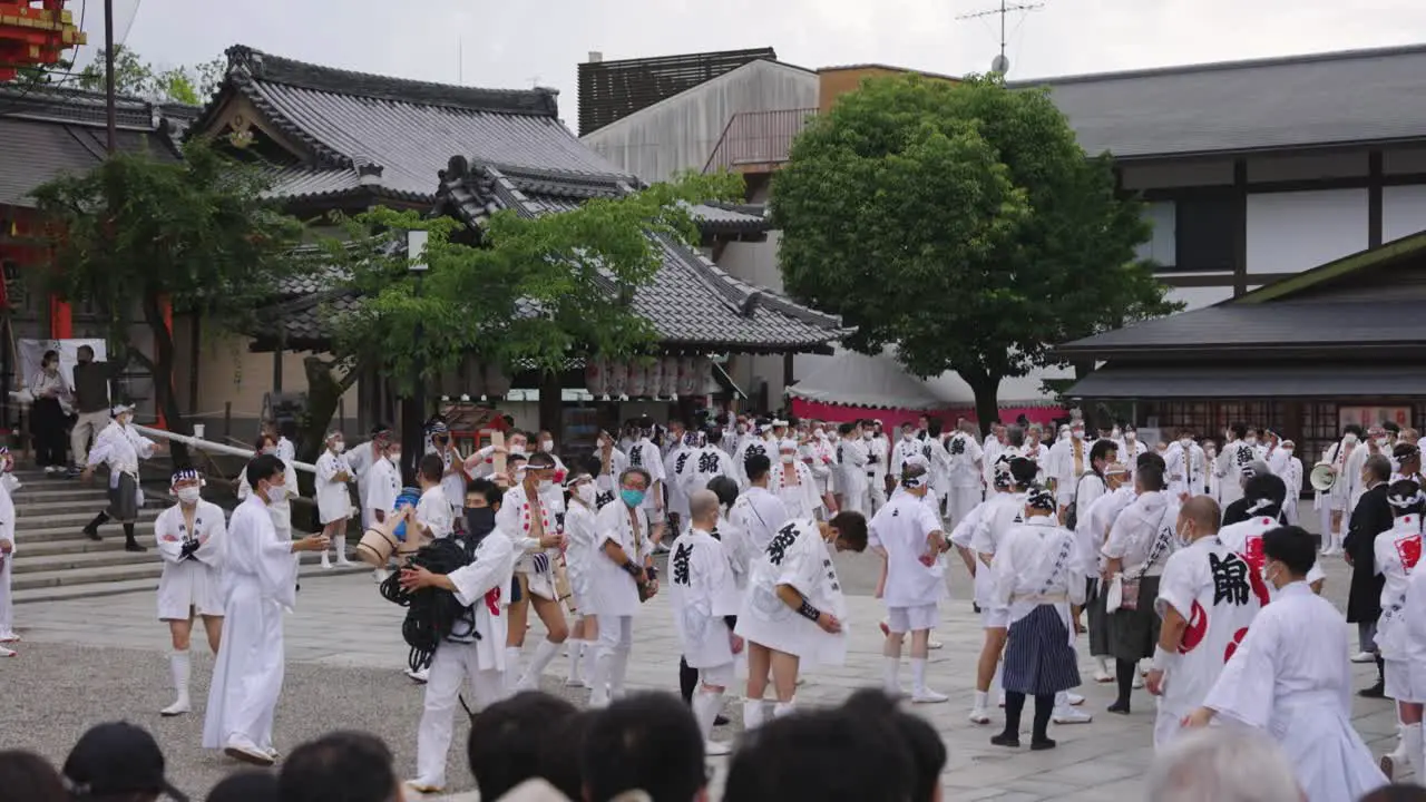 Japanese Men Gather to Begin Gion Matsuri Event at Yasaka Jinja