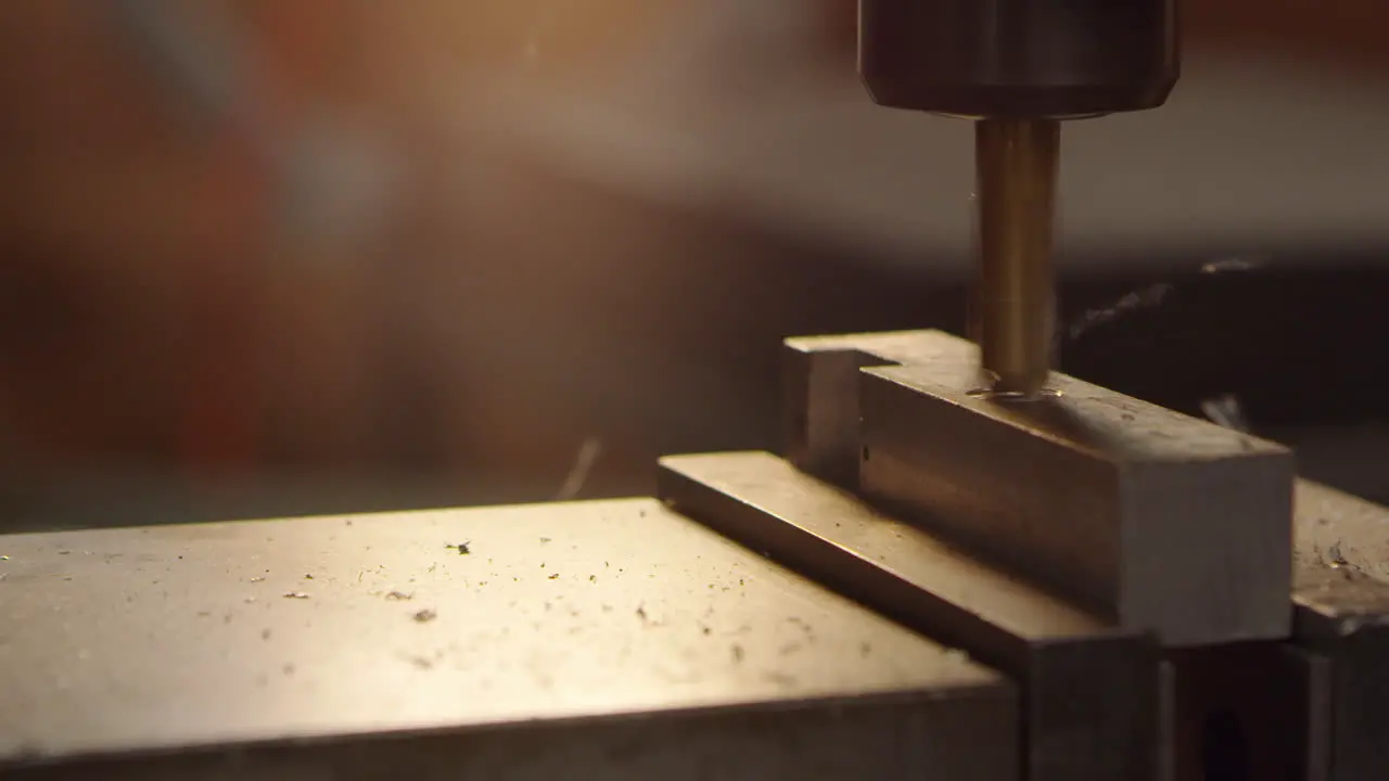 Close Up Of Drilling Metal Block In Factory Shot On R3D