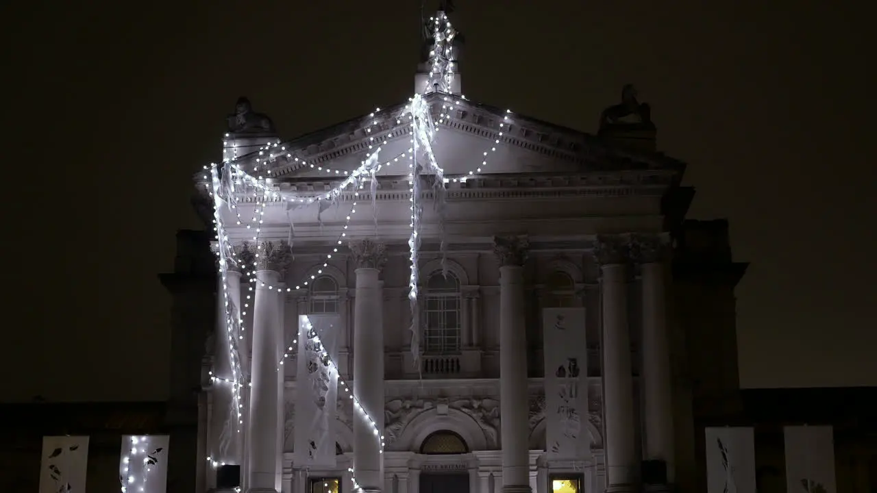 Holiday lights decorate the exterior of the Tate Britain museum during Christmas time