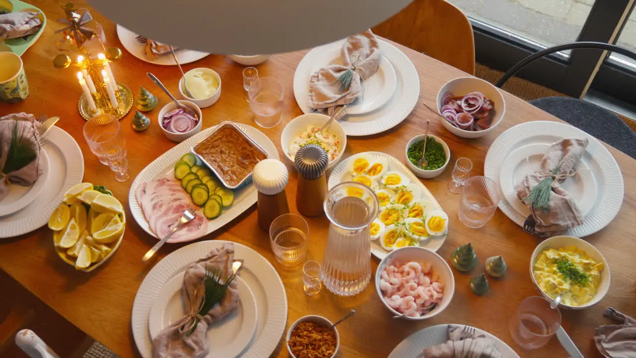 Festive Scandinavian 'Julefrokost' with traditional dishes and elegant table setting