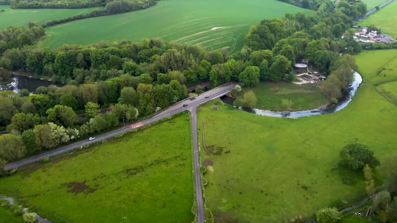 Aerial footage of green fields and country roads