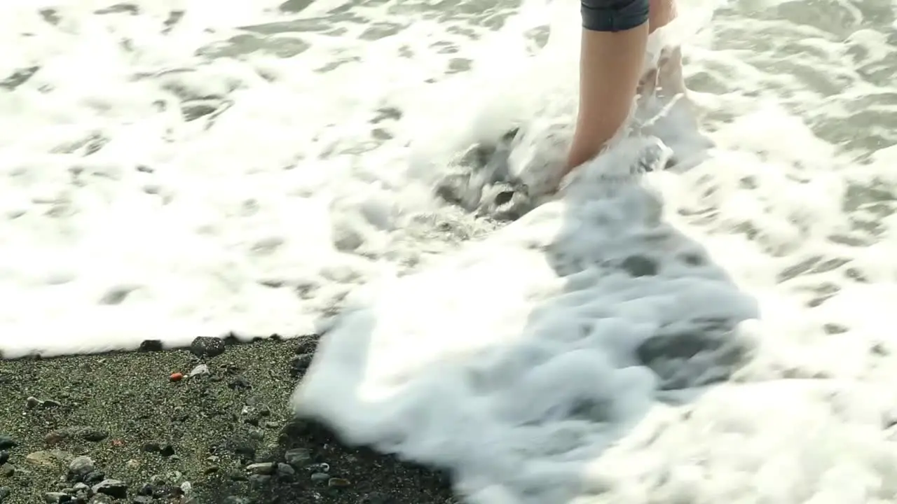 Girl Picks Up Pebble Beach