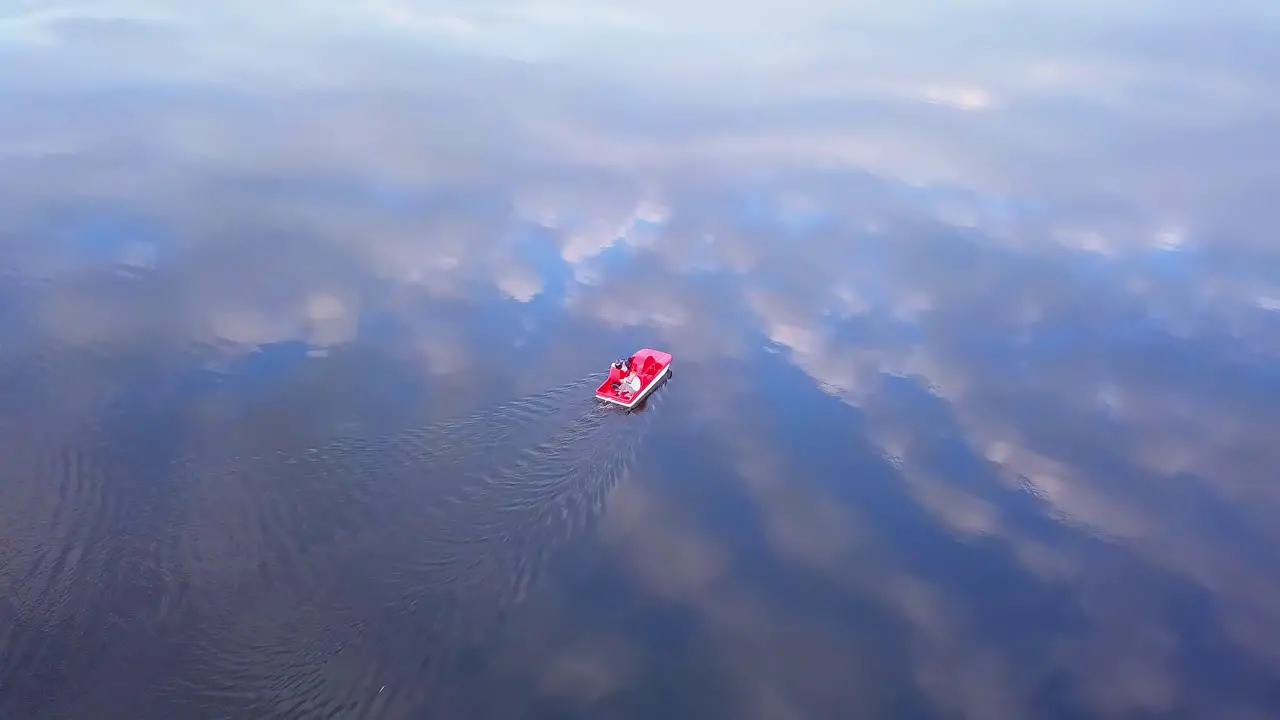 Family on a Pedal Boat at Sunset Aerial Shot