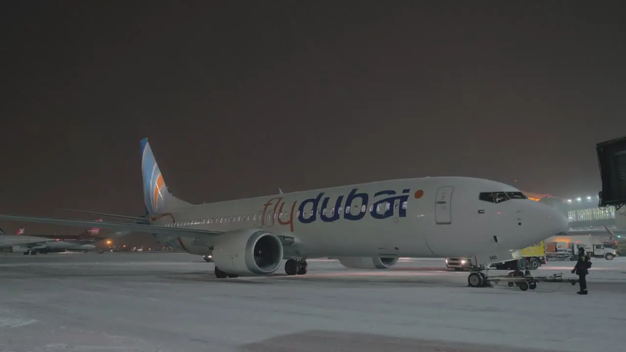 Parked Boeing 737 MAX-8 FlyDubai in Sheremetyevo Airport at winter night