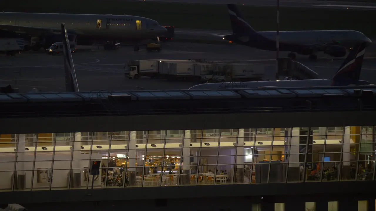 Terminal and airplanes traffic in Sheremetyevo Airport at night