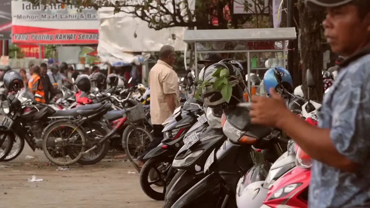 Man Standing by a Row of Motorcycles