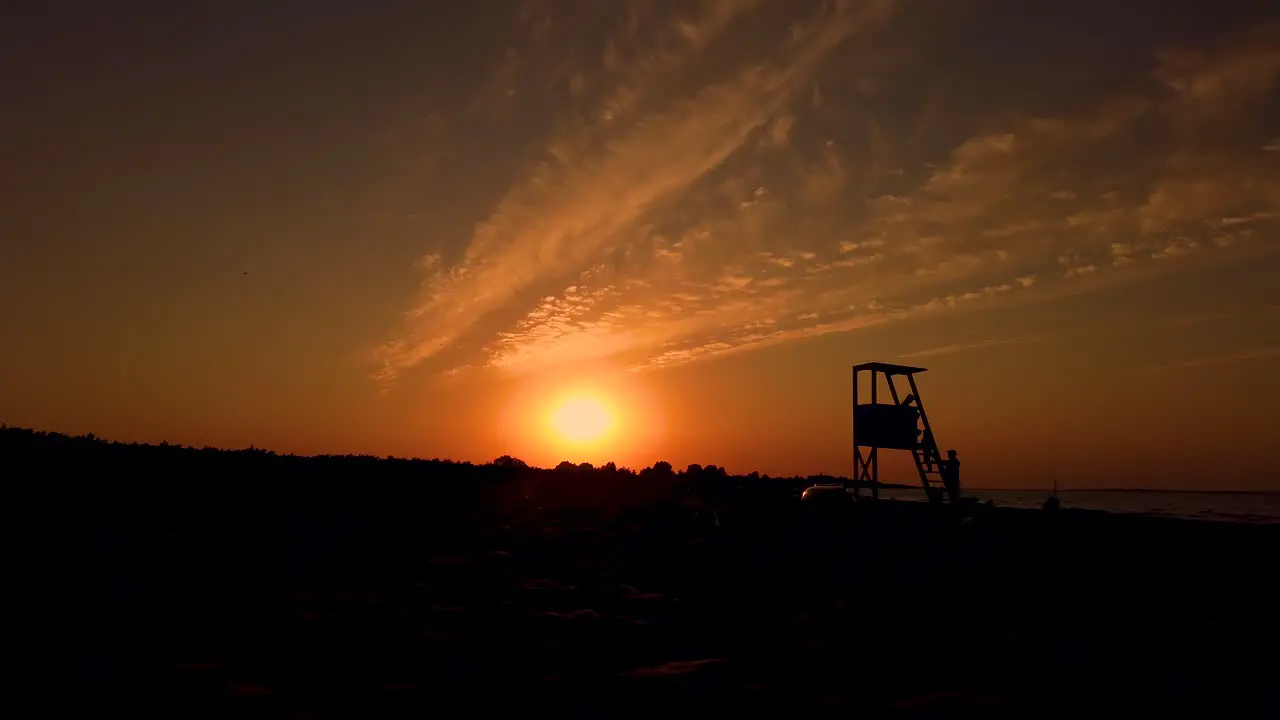 Lifeguard Tower Silhouetted by the Sunset