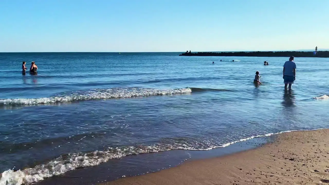 Wide-angle view of the seaside with people having fun in Hyeres France