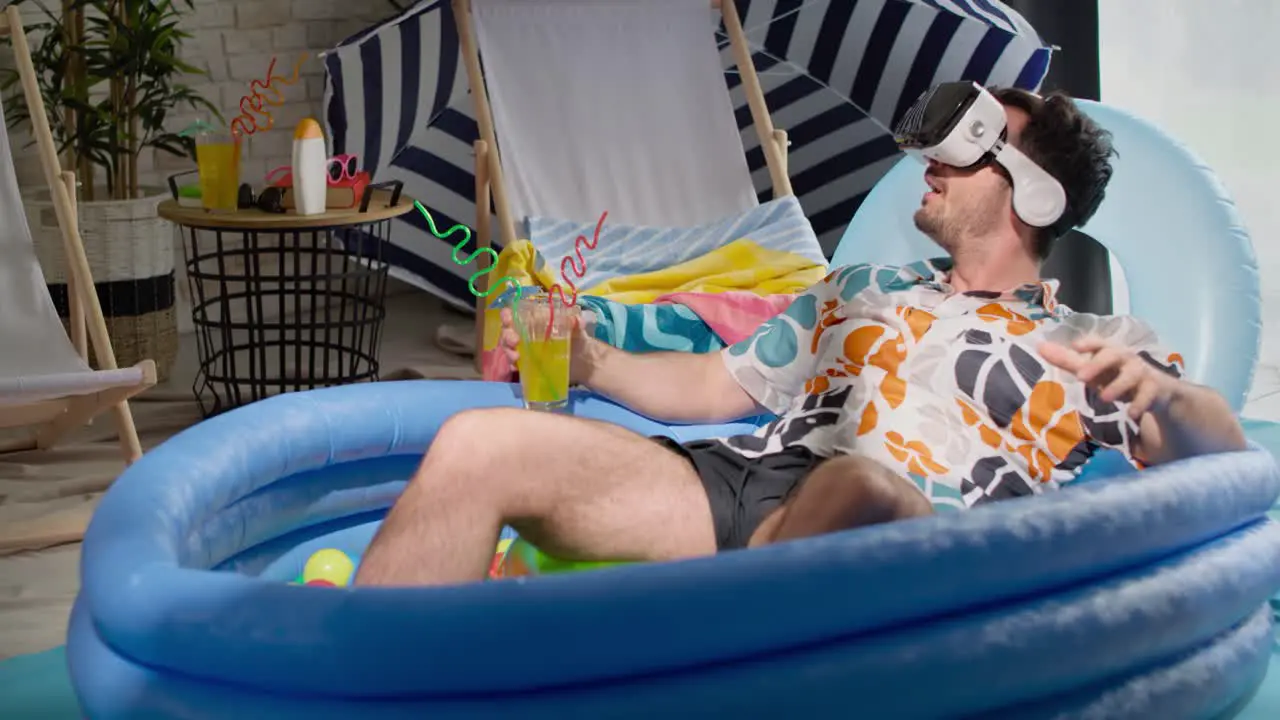 Video of man with VR glasses in an inflatable pool