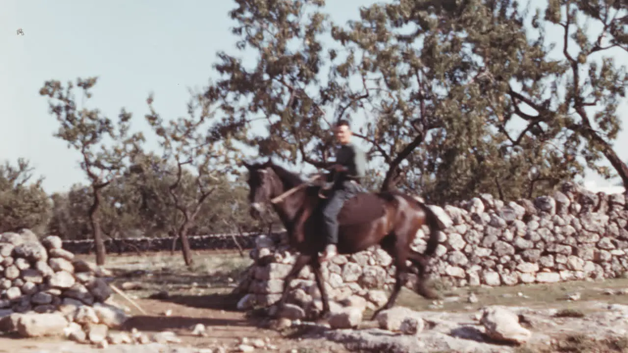 Strong horseman in Italy countryside in 1960s