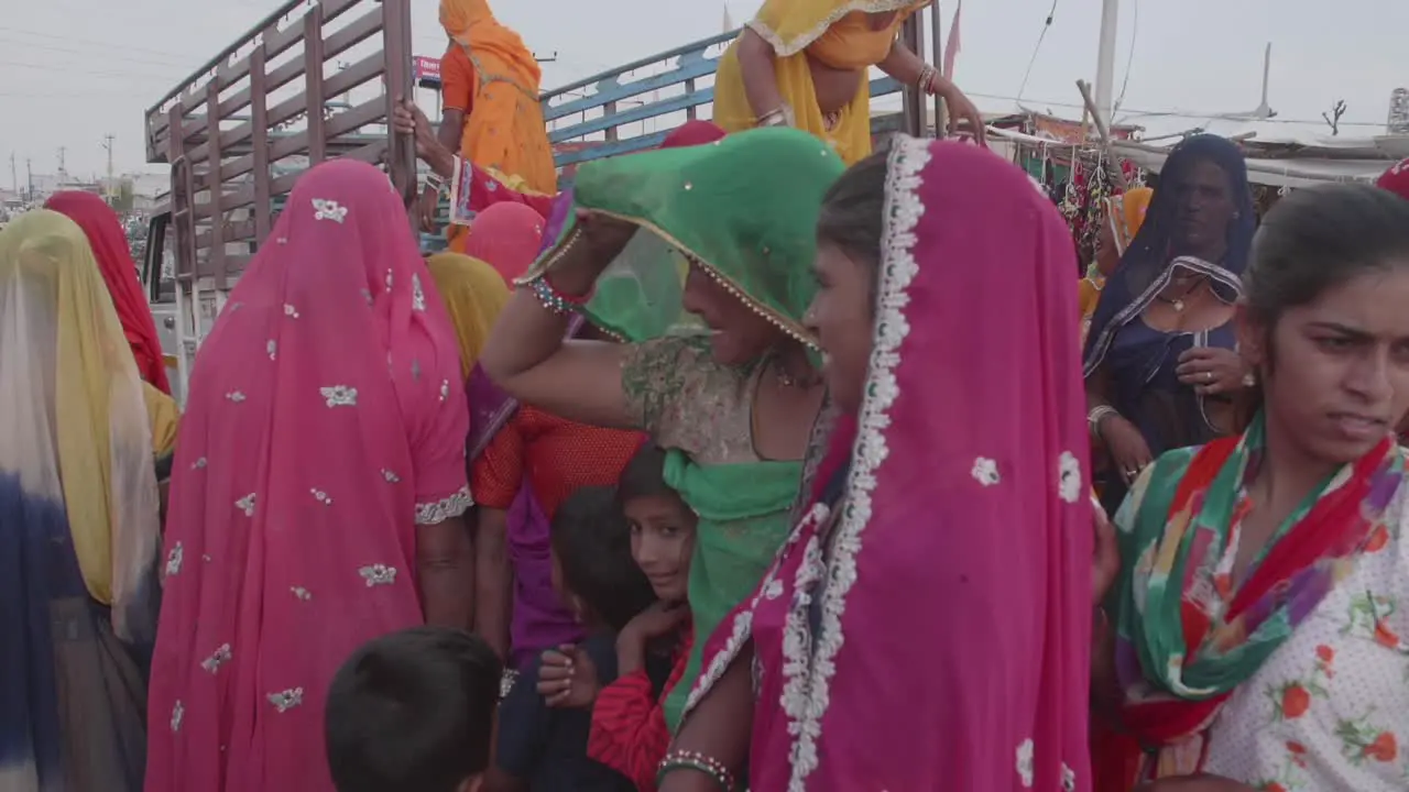 Young beautiful Indian women and children congregate together